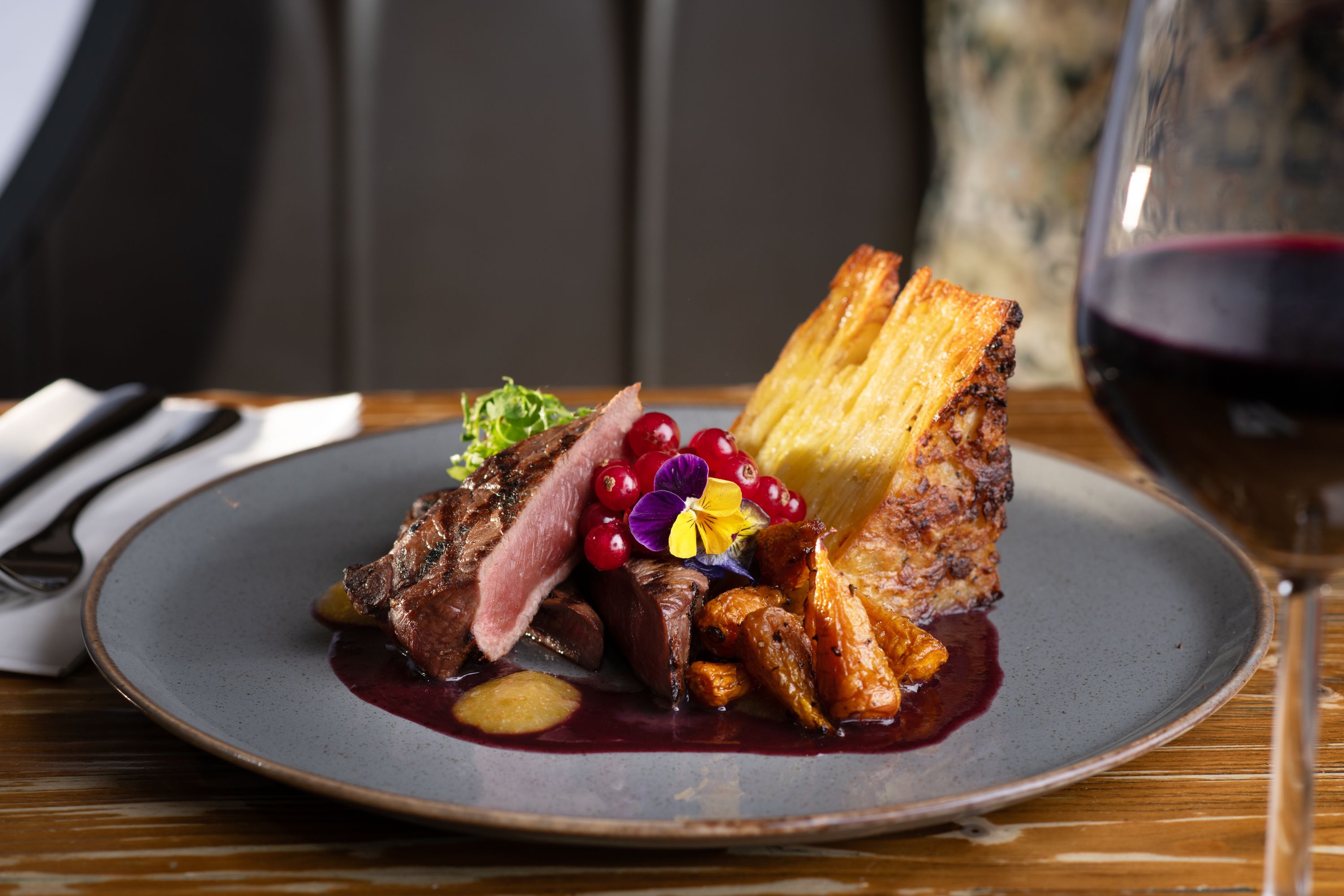 beef dish in the restaurant with red wine