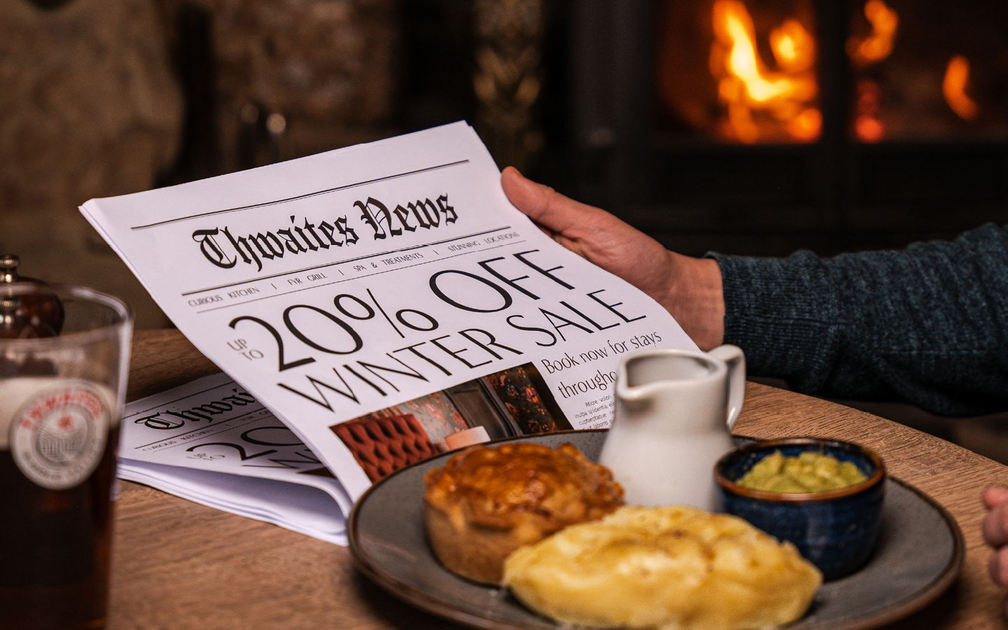 'up to 20% off' newspaper at a pub table
