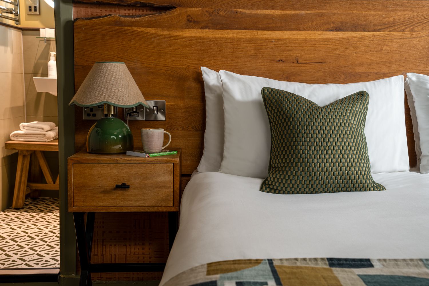 bedside table with a book and coffee