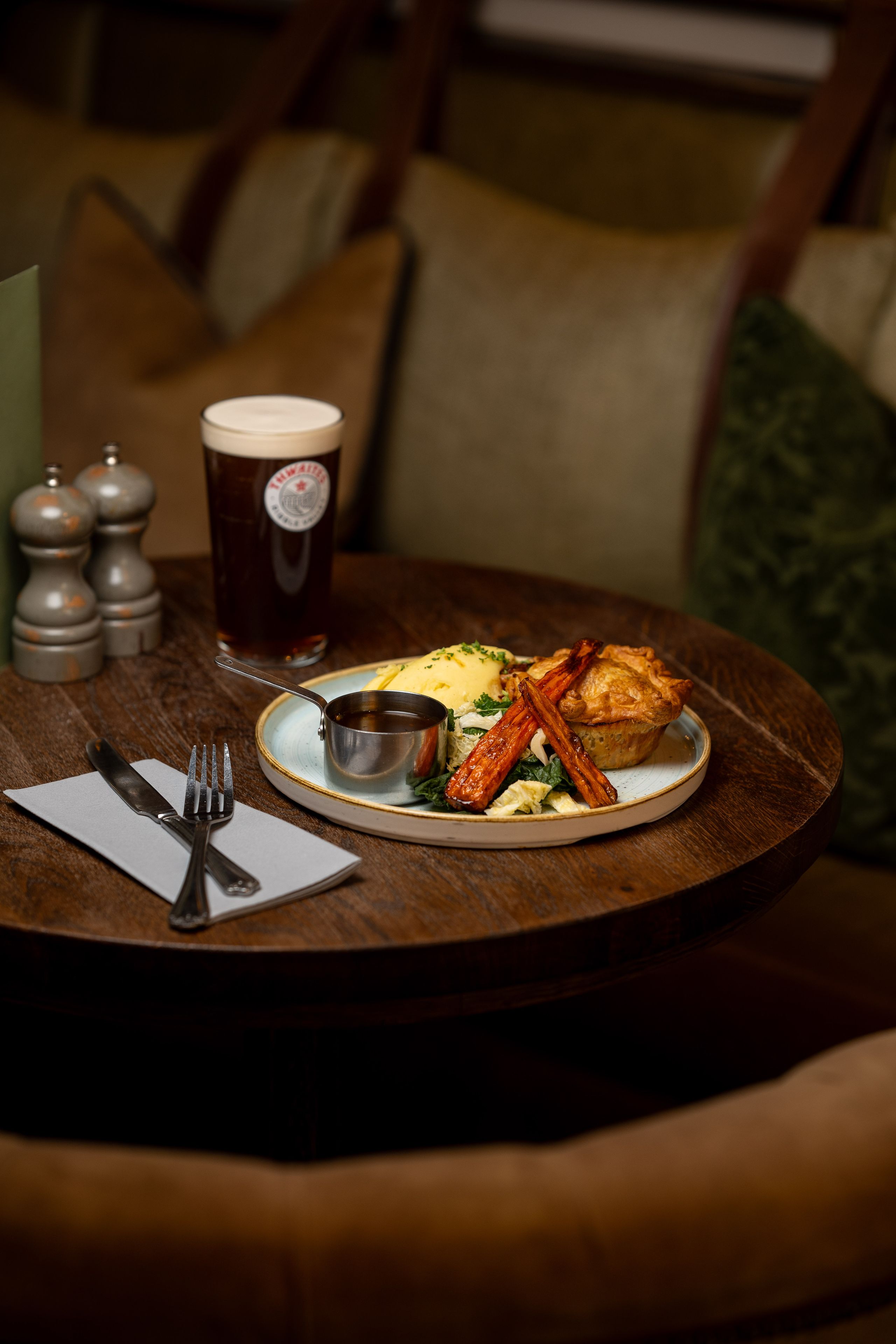 pie and mash dish with a pint of thwaites ale